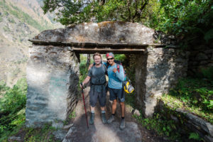 Fatigued, Drenched but still thirsty for more adventure, Dave and Rajat standing in the entry of Lokpa.